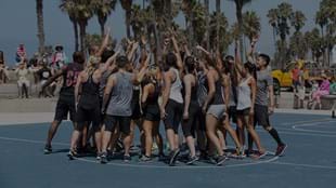 The LES MILLS GRIT™ team celebrate after an awesome workout at Venice Beach