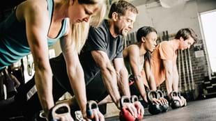 Exercisers with kettlebells